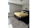 Comfortable bedroom with a queen-sized bed, neutral walls, and vinyl flooring at 940 Pamela Ln, Rocky Mount, NC 27803