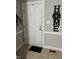 Inviting front entrance with white door and decorative 'HOME' wall art at 940 Pamela Ln, Rocky Mount, NC 27803