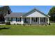 Charming single-story home with a welcoming front porch and well-manicured lawn at 940 Pamela Ln, Rocky Mount, NC 27803