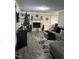 Inviting living room with a brick fireplace, modern decor, and comfortable seating at 940 Pamela Ln, Rocky Mount, NC 27803