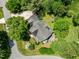A lush and well-manicured backyard surrounds this home, set back from the street for maximum privacy at 100 Michaels Way, Chapel Hill, NC 27516