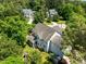 Aerial view of the home with a screened in porch and playground surrounded by mature trees at 100 Michaels Way, Chapel Hill, NC 27516