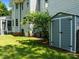 The backyard features a storage shed and mature landscaping at 100 Michaels Way, Chapel Hill, NC 27516