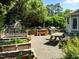 A backyard patio with a picnic table, grill and garden at 100 Michaels Way, Chapel Hill, NC 27516
