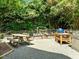 Outdoor living space with picnic table, raised garden beds, and outdoor cooking area at 100 Michaels Way, Chapel Hill, NC 27516