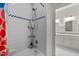 Bathroom featuring a shower/tub with a tiled backsplash and a view into the vanity area at 100 Michaels Way, Chapel Hill, NC 27516