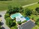 Aerial view of a community pool and playground, offering residents a variety of recreational activities at 100 Michaels Way, Chapel Hill, NC 27516
