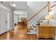 Inviting foyer with hardwood floors, staircase, and view into the elegant dining room at 100 Michaels Way, Chapel Hill, NC 27516