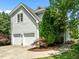 This home boasts a two-car garage and manicured landscaping, perfect for those who appreciate curb appeal at 100 Michaels Way, Chapel Hill, NC 27516