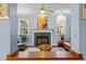 Warm living room features a fireplace, and a large window, providing a cozy and naturally lit space at 100 Michaels Way, Chapel Hill, NC 27516