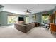 Inviting living room with comfortable seating, large windows, and a media center, perfect for relaxation and entertainment at 100 Michaels Way, Chapel Hill, NC 27516