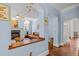 Open-concept design showcasing the living room's connection to other areas, with hardwood floors and arched entryways at 100 Michaels Way, Chapel Hill, NC 27516