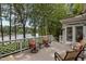 Inviting back deck overlooking serene lake view, furnished with comfortable seating, ideal for outdoor relaxation and entertaining at 1009 Bearglades Ln, Raleigh, NC 27615
