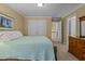 Bedroom with double bed, light yellow walls, closet and carpet at 1009 Bearglades Ln, Raleigh, NC 27615