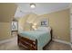 Bedroom with a bed, carpet and light yellow walls at 1009 Bearglades Ln, Raleigh, NC 27615