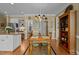 Charming dining area featuring a wooden table set, decorative chandelier, and stylish decor, perfect for Gathering gatherings at 1009 Bearglades Ln, Raleigh, NC 27615