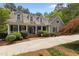 Charming home featuring a meticulously landscaped front yard, inviting entrance, and classic architectural details at 1009 Bearglades Ln, Raleigh, NC 27615