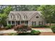 Picturesque home showcasing classic architecture, mature landscaping, and a welcoming front entrance at 1009 Bearglades Ln, Raleigh, NC 27615
