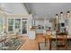 Bright, open concept living space flowing into the kitchen and dining area, perfect for entertaining and Gathering life at 1009 Bearglades Ln, Raleigh, NC 27615