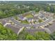 A lovely aerial view of the townhome community surrounded by trees at 1022 Flagler St, Durham, NC 27713