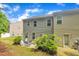 A patio space with chairs and grill in the backyard for outdoor relaxation at 1022 Flagler St, Durham, NC 27713