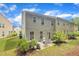 A patio space with chairs and grill in the backyard for outdoor relaxation at 1022 Flagler St, Durham, NC 27713