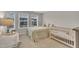 Cozy bedroom with multiple windows and a crib, creating a serene space at 1022 Flagler St, Durham, NC 27713