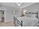 Relaxing bedroom featuring a ceiling fan, natural light, and a comfortable bed at 1022 Flagler St, Durham, NC 27713