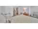 Well-lit bedroom with comfortable crib and chair at 1022 Flagler St, Durham, NC 27713