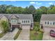 A street view of the home with manicured lawns and attached garages at 1022 Flagler St, Durham, NC 27713