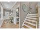 Inviting foyer featuring beautiful hardwood floors, elegant wainscoting, and a staircase at 1022 Flagler St, Durham, NC 27713
