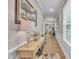 Inviting entryway with a light wood floor and elegant wainscoting accents at 1022 Flagler St, Durham, NC 27713