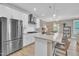 Bright kitchen featuring stainless steel appliances, granite countertops, and a central island with seating at 1022 Flagler St, Durham, NC 27713