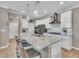 Modern kitchen featuring a large island with granite countertops, stainless steel appliances, and stylish pendant lighting at 1022 Flagler St, Durham, NC 27713