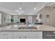 Kitchen island with sink and view to the living room, featuring an open concept design at 1022 Flagler St, Durham, NC 27713