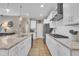 Well-lit kitchen with granite countertops, stainless steel appliances, and white cabinets at 1022 Flagler St, Durham, NC 27713
