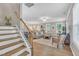 Open-concept living room with lots of natural light and a staircase at 1022 Flagler St, Durham, NC 27713