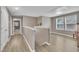 Bright and airy loft area with wood flooring and natural light from the windows at 1022 Flagler St, Durham, NC 27713