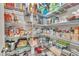 Organized pantry with wire shelving, filled with various food and household items at 1022 Flagler St, Durham, NC 27713