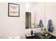 Stylish powder room featuring modern fixtures and decorative butterfly art at 103 Harrington Pt, Chapel Hill, NC 27516