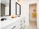 Bright bathroom features double sinks, a marble countertop, modern lighting, and white shaker cabinets at 103 Harrington Pt, Chapel Hill, NC 27516