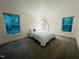 Spacious bedroom featuring carpet and a modern arched floor lamp at 103 Harrington Pt, Chapel Hill, NC 27516