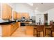 Modern kitchen featuring stainless steel appliances, black granite countertops, and a functional island at 103 Harrington Pt, Chapel Hill, NC 27516
