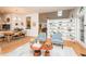 Bright living space with hardwood floors, stylish seating, built-in shelving, and a modern aesthetic at 103 Harrington Pt, Chapel Hill, NC 27516