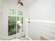 Stairway with modern railing and large window overlooking the wooded property at 103 Harrington Pt, Chapel Hill, NC 27516