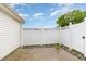 Cozy backyard featuring a white vinyl fence and a small patio area at 103 Rama Ct, Morrisville, NC 27560