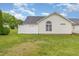 View of the backyard featuring a white fence and lush green grass at 103 Rama Ct, Morrisville, NC 27560
