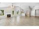 Bright, open living room with vaulted ceilings, fireplace, and wood laminate flooring at 103 Rama Ct, Morrisville, NC 27560