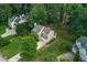 Aerial perspective of a home surrounded by lush greenery, highlighting the expansive yard and mature trees at 107 Ivy Hollow Ct, Morrisville, NC 27560