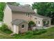 An aerial view of a two-story house featuring a backyard, deck, small office, and a lawn at 107 Ivy Hollow Ct, Morrisville, NC 27560
